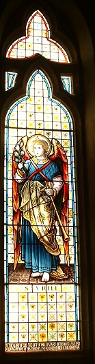 All Saints Church Rennington  Church Guide - Picture of the Archangel Uriel in window 